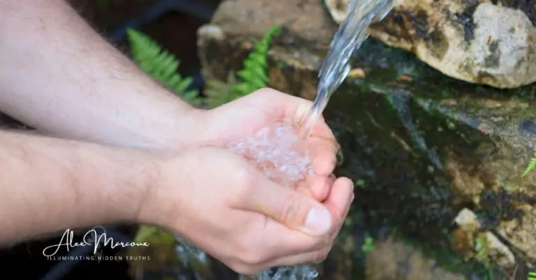 Hands cupping flowing water representing the plasma friends' healing energy and water consciousness
