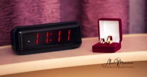 Person noticing 11:11 on clock showing spiritual number synchronicity