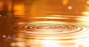 Golden light flowing like water, symbolizing abundance consciousness